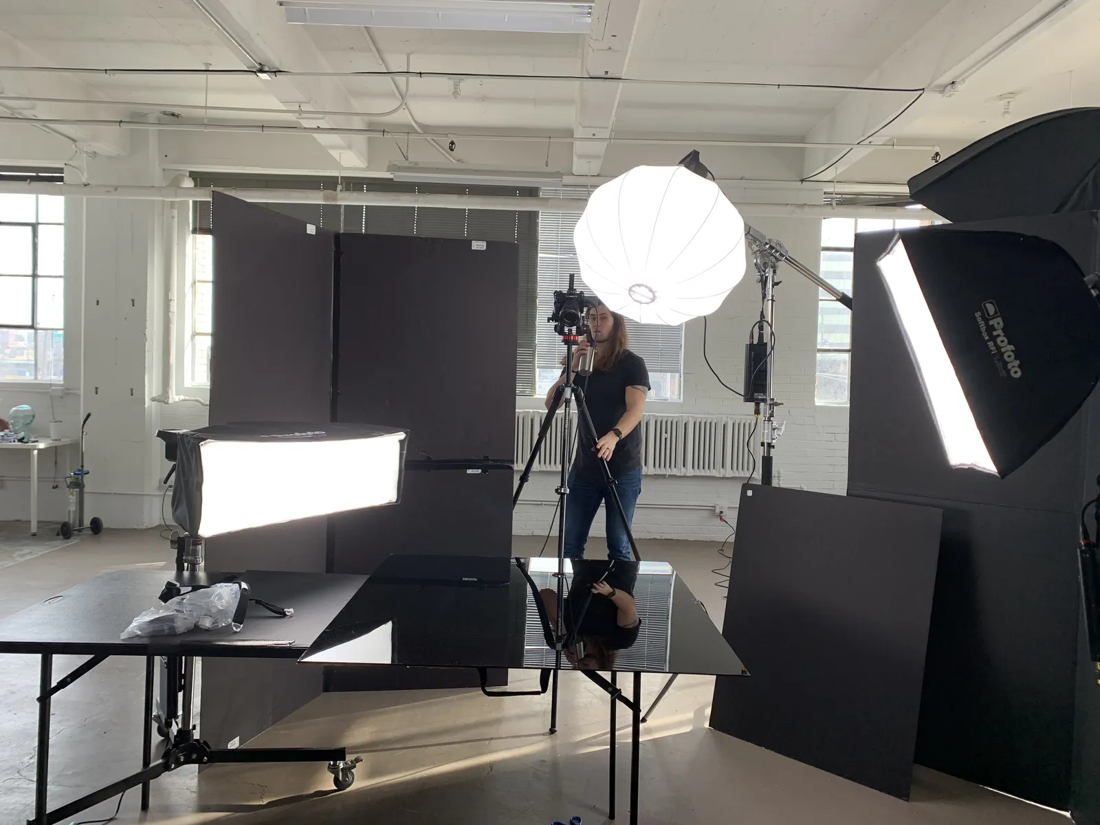Kyle Williams behind the camera in a loft studio